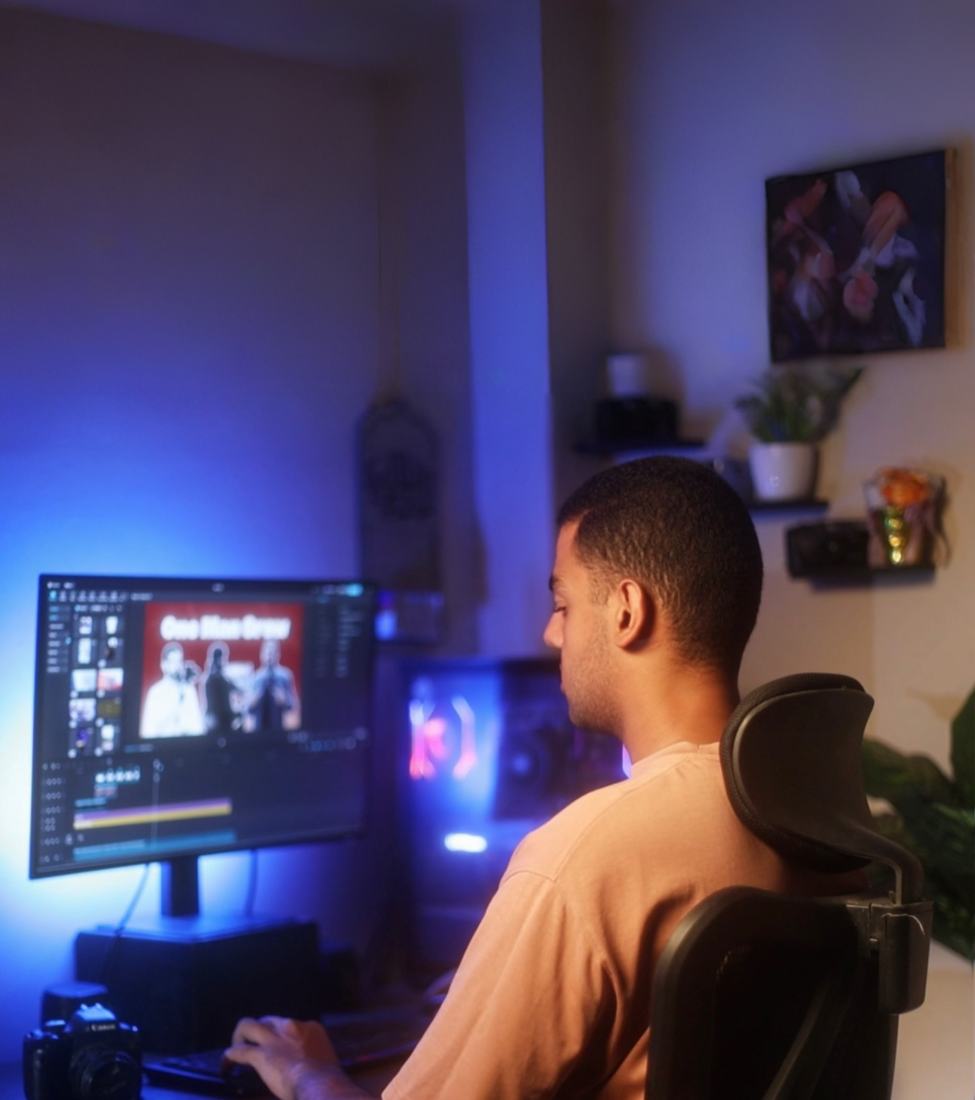 Youssef editing video at his workstation