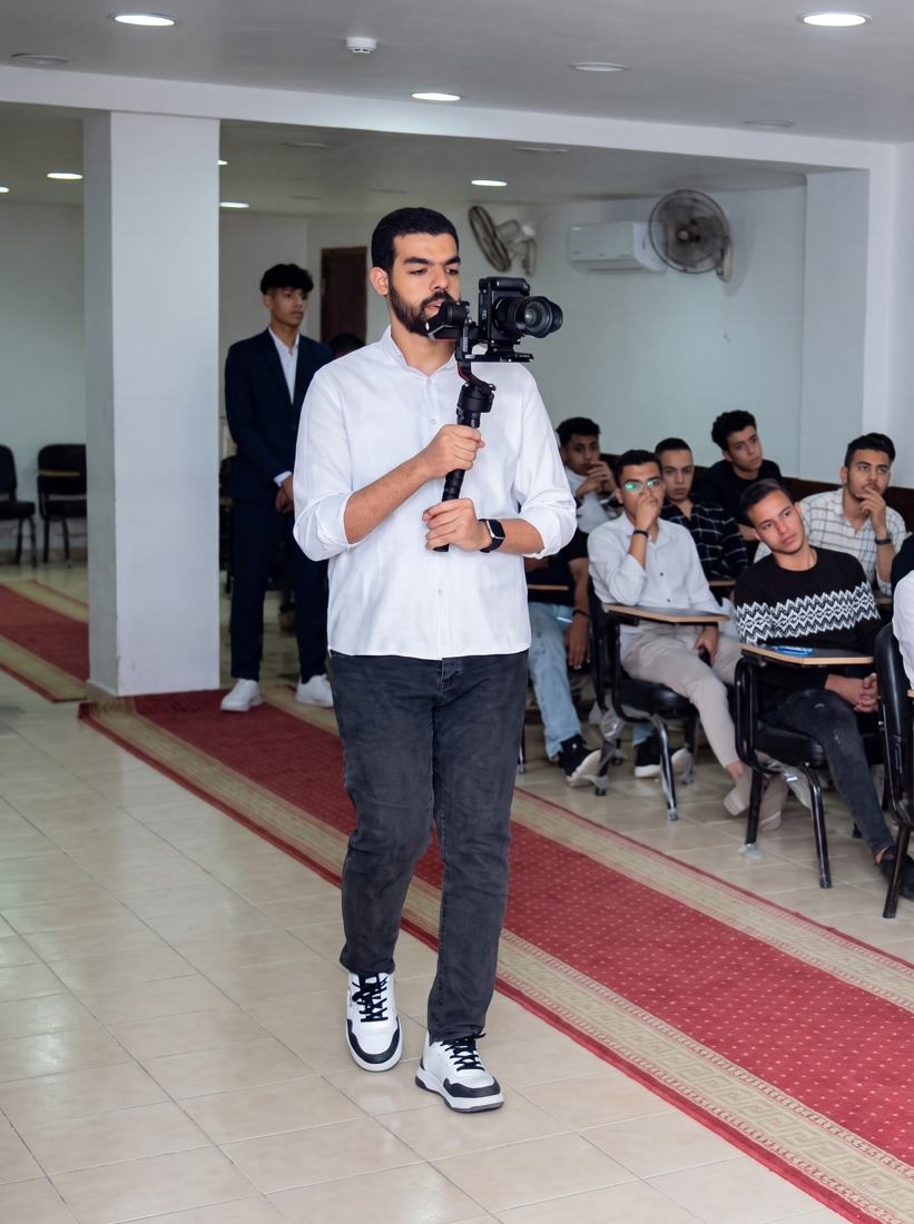 Youssef filming with a camera